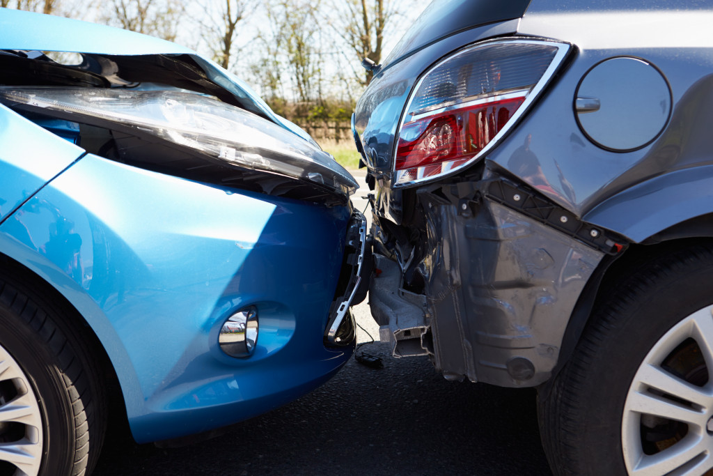 Two cars in an accident with one back-ending the other.